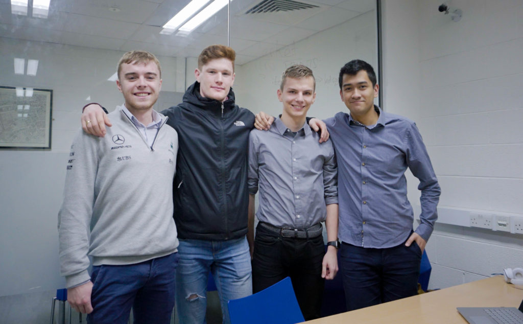 The boys smiling at the camera